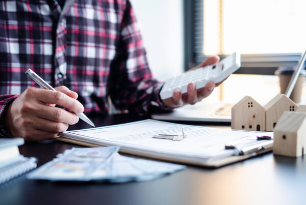 A prospective homeowner calculating the best mortgage loan option.